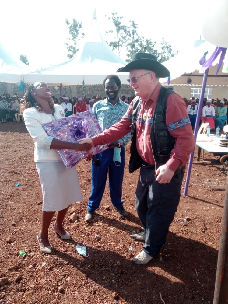 George accepts gift from Jacinta and Patrick