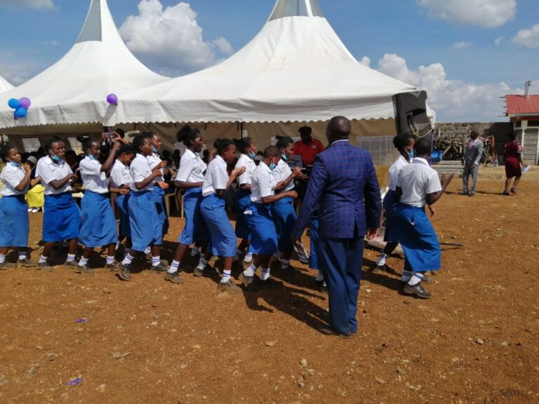 Students entertain attending guests with song and dance