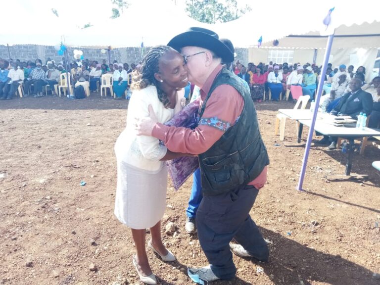 George Hutchings and Jacinta Chengecha share a hug