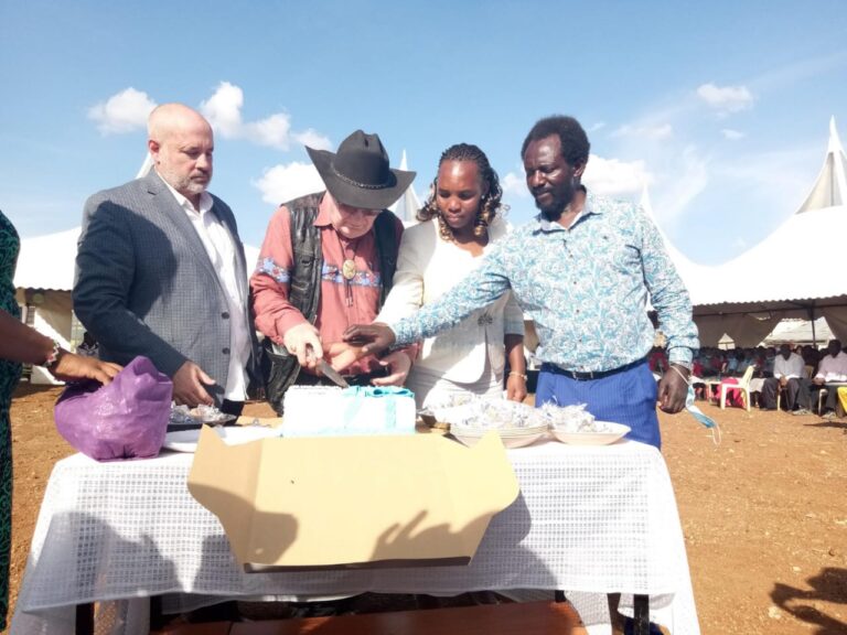 Jacinta, Patrick cut the cake with George and Dr. Tim